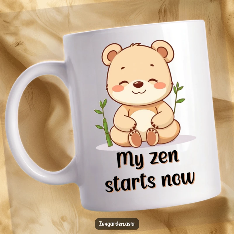 Funny meditating bear cub mug with eyes closed, beaming with joy next to a small bamboo plant, radiating inner peace and happiness.