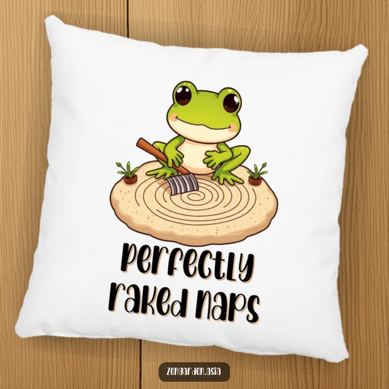 Funny Frog Zen Master Pillow featuring a frog carefully raking a miniature sand garden, bringing serene comfort.