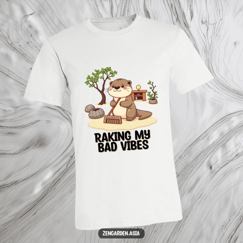 Funny otter zen t-shirt, a happy otter carefully raking sand in a peaceful zen garden, serene and humorous design.
